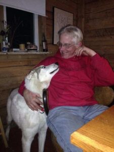 Andy Bassich holding his sled dog