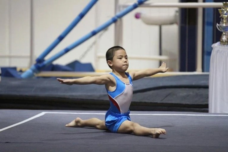 Young Asher Hong competes during a gymnastics in 2011